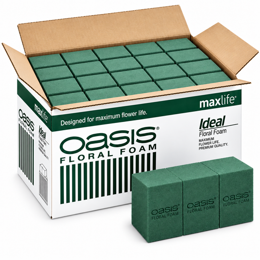 Caixa aberta de espuma floral OASIS Ideal Maxlife com tijolos verdes e um tijolo em primeiro plano.
